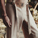 Traditional pants with intricate patterns on a blurred natural background