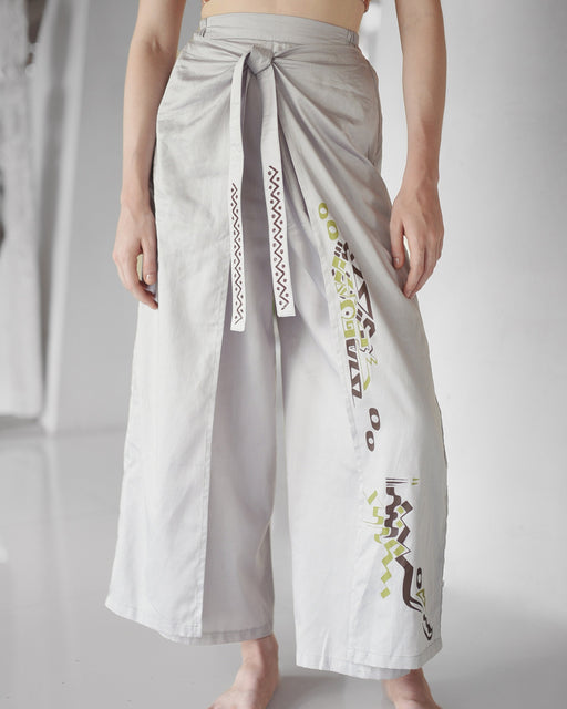 Luxurious silver Thai pants crafted from breathable silk-cotton blend, featuring artisanal stitching for a relaxed, stylish fit
