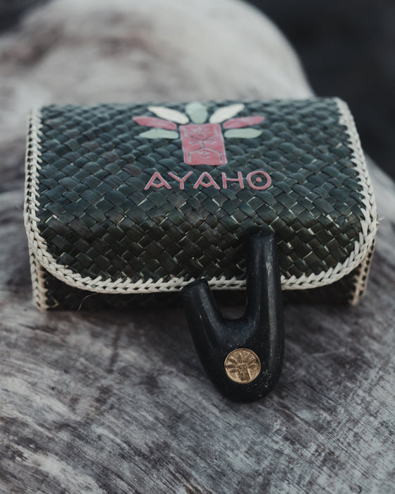 Woven pouch with 'AYAHO' branding on a textured surface