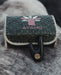 Woven pouch with 'AYAHO' branding on a textured surface