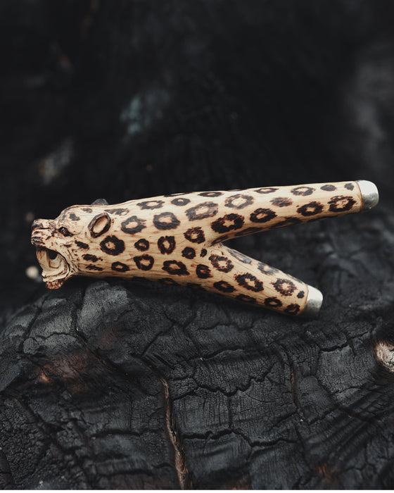 Leopard print object on a dark textured surface