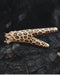 Leopard print object on a dark textured surface