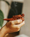 Elegant wood smoking pipe with a dragon design, providing a relaxing smoking experience.