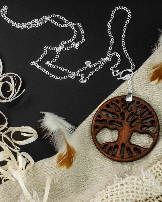 Discover the spiritual elegance of the "Tree of Life" Jewelry Set, handcrafted from rosewood and silver by Bali's Ayaho house. Symbolizing unity, growth, and protection, it's an art piece offering spiritual safeguarding and a connection to nature's essence.