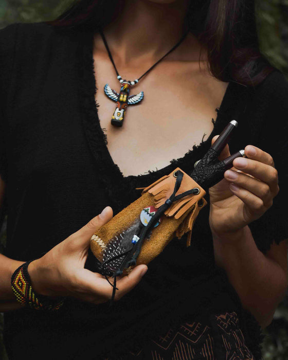 Traditionally crafted leather shamanic bag adorned with ethnic motifs, perfect for storing kuripe and hape tools, embodying the essence of ritual and tradition