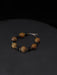 Bracelet with wooden beads on a dark background