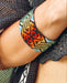 Handwoven bead loom bracelets with Ayahuasca-inspired tribal patterns, combining shamanic tools and talisman amulets for spiritual adornment