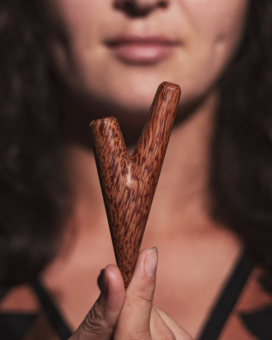 Coconut wood kuripe captured in natural lighting, highlighting its rich colors and textures