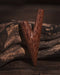 Coconut wood kuripe alongside hape snuff, illustrating its use in traditional ceremonies