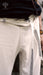 Close-up of light gray pants with black geometric patterns, worn by a person, with 'AYAHO' branding visible.