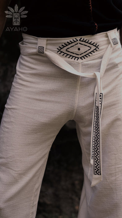 Beige pants with black geometric embroidery and a white belt, featuring the AYAHO brand.