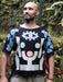 Man wearing a black t-shirt with abstract design outdoors