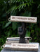 Decorative item with 'Palosanto Retreat' text on a dark background