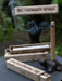 Palo Santo incense sticks with smoke and packaging on a dark surface