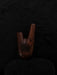 Wooden shoe tree on a dark textured background