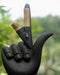 Black gardening glove with a tool resembling a finger