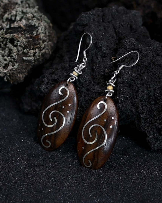 Handcrafted matching carved earrings set, embodying spiritual harmony, reflecting shamanic protection
