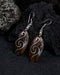 Handcrafted matching carved earrings set, embodying spiritual harmony, reflecting shamanic protection