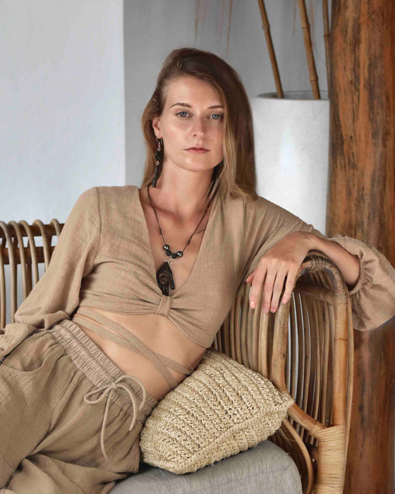 Handmade Rings of Unity earrings crafted from blackwood and silver, symbolizing love and spiritual connection, from a collection of shamanic tools