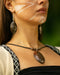Handcrafted rosewood pendant and matching carved earrings set, embodying spiritual harmony with black kyanite and Rudraksha beads, reflecting shamanic protection