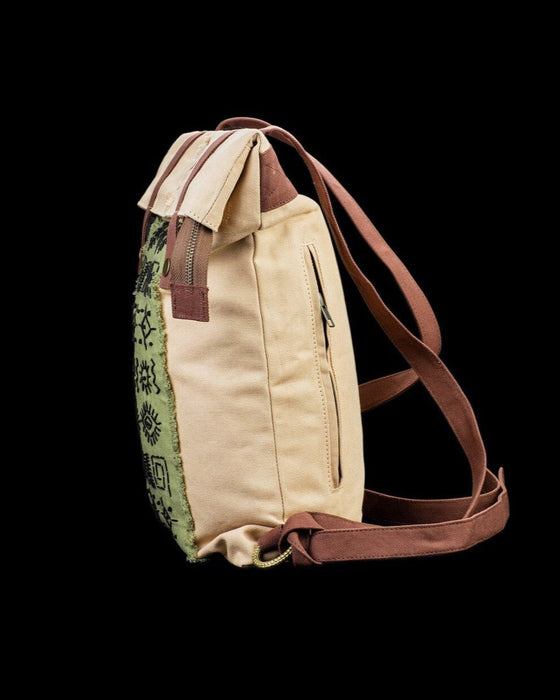 Artisanal ethnic style backpack crafted from natural canvas, featuring distinctive embroidery for the bohemian spirit, ideal for daily ventures and festivals