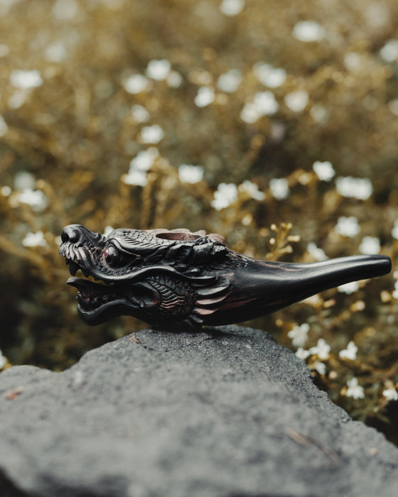 Artisan-quality black wood smoking pipe featuring a stunning dragon design, perfect for daily use.