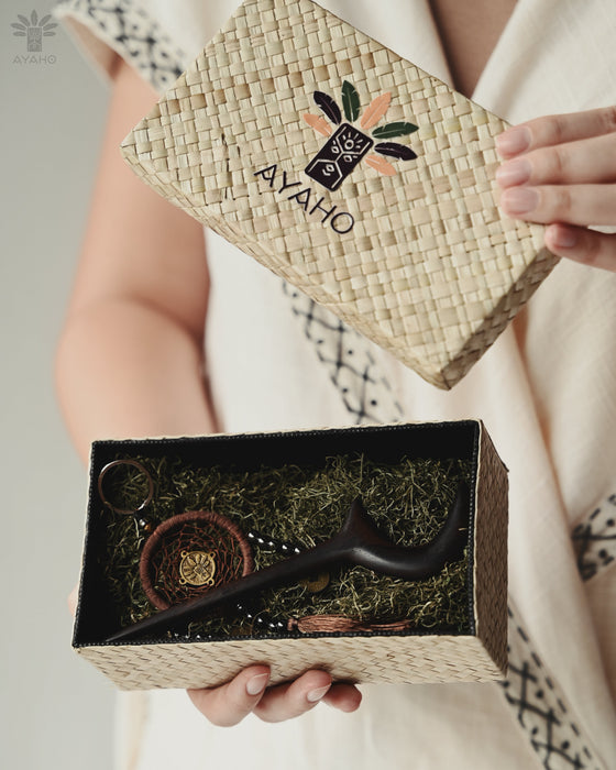 Artisan-carved moon clip with subtle wood knots, styled in a messy braid at a sunset gathering.