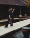 Person practicing yoga by a poolside with traditional architecture in the background
