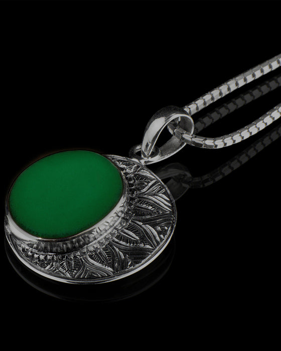 Striking ye ming zhu pendant encapsulated in intricate silver, a magic item believed to grant protection and fortune, perfect for anniversaries or spiritual milestones