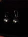 Pair of earrings on a dark background