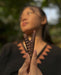 Channel ancient traditions with this Rosewood Kuripe, a shamanic tool and necklace applicator for personal Rapéh use, a unique gift of herbal wisdom.