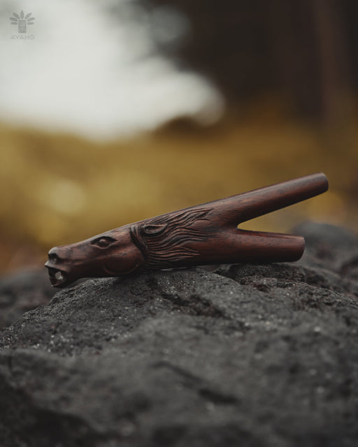 Wooden clip with horse design on a textured surface