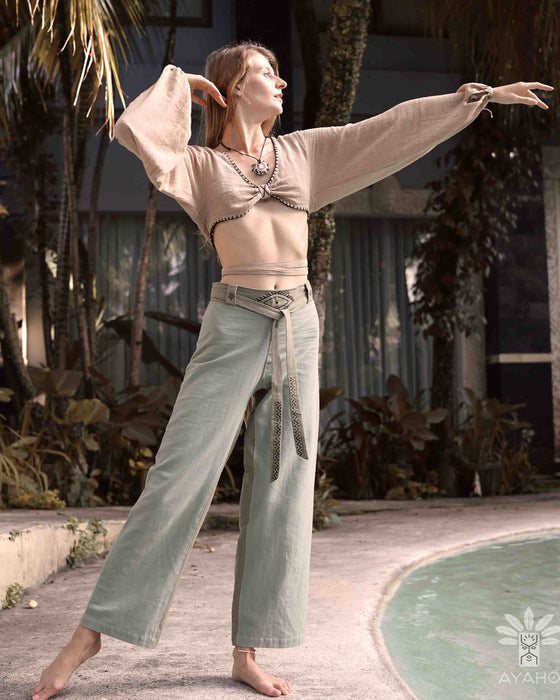Detail of unisex boho organic cotton pants featuring a distinctive sacred geometry pattern on the belt, handcrafted for a blend of style and comfort in bohemian fashion