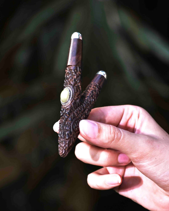 Experience the spiritual essence with this handmade Kuripe, showcasing Balinese design in rosewood with silver and Ye Ming Zhu stone—a shamanic snuff applicator for healing and meditation.