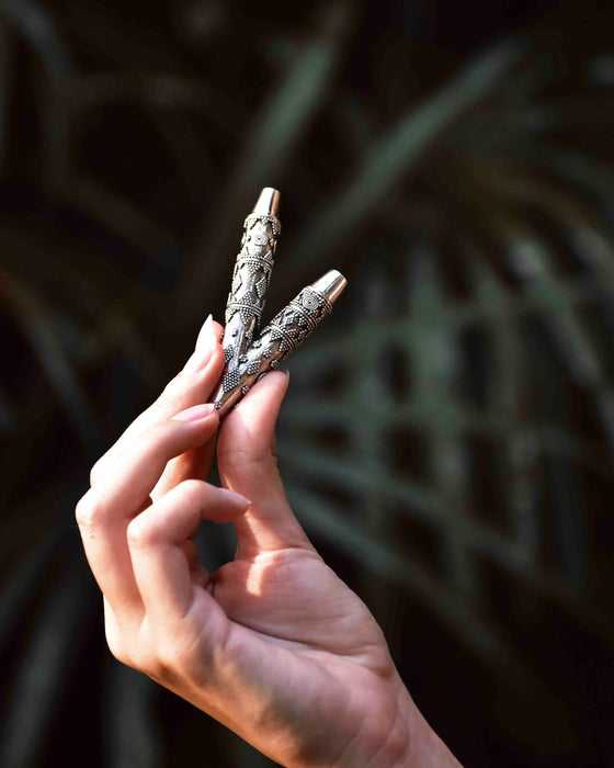 Elevate your spiritual sessions with this sterling silver Kuripe, a masterfully crafted snuff applicator. Its ornate design not only serves as a shamanic tool but also as a wearable piece of art, doubling as a unique kuripe necklace. Ideal for hape snuff rituals, this piece is a handcrafted gift that embodies tradition and protection.