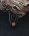 Bronze logo on Kuripe made from volcanic stone, adding sophistication.