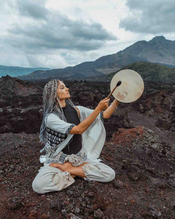 Hand-tuned tribal drum with intricately carved dragon handle, perfect for sound healing and spiritual ceremonies, crafted for a premium cosmic sound experience