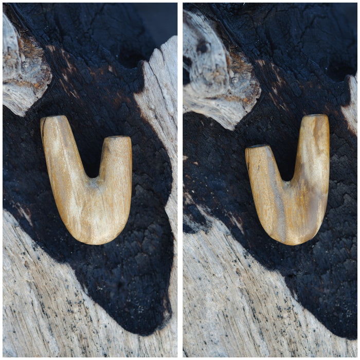 Natural harmony in the Kuripe pipe crafted from petrified wood, reflecting the beauty of nature.