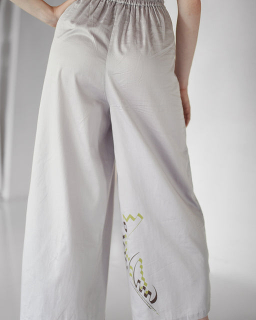 Handmade silver Thai pants featuring a silky cotton texture, ideal for casual wear or festival fashion.