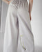Handmade silver Thai pants featuring a silky cotton texture, ideal for casual wear or festival fashion.