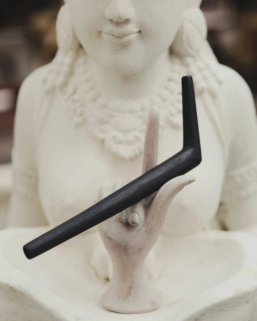 Traditional tepi pipe surrounded by ritual accessories, emphasizing authentic craftsmanship and spiritual purpose