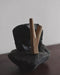 Teakwood kuripe used in a traditional setting, reflecting its cultural significance in shamanic practices.