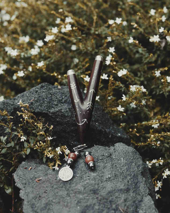 Wooden Intention kuripe pipe necklace with silver accents for hape snuff, a unique, handcrafted shamanic tool for herbal medicine rituals.