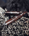 Wooden Intention kuripe pipe necklace with silver accents for hape snuff, a unique, handcrafted shamanic tool for herbal medicine rituals.