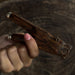 Unique kuripe pipe featuring a bear totem, handcrafted from mango wood