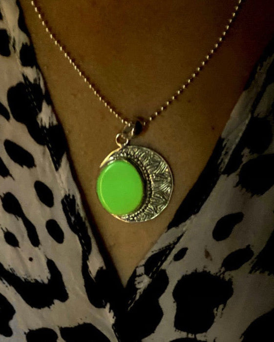Striking ye ming zhu pendant encapsulated in intricate silver, a magic item believed to grant protection and fortune, perfect for anniversaries or spiritual milestones