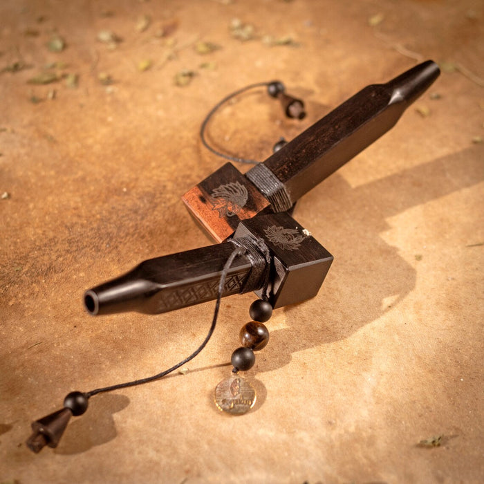 Wooden tool with metal components on a textured brown surface