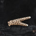 Leopard print object on a textured black surface