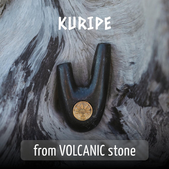 Black and gold tool on a volcanic stone surface with 'Kuripe' branding.