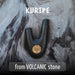 Black and gold tool on a volcanic stone surface with 'Kuripe' branding.